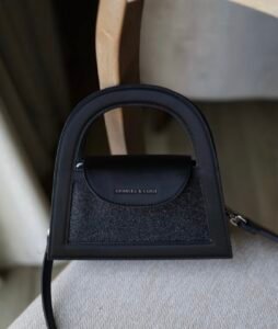 Este glittered top handle bag